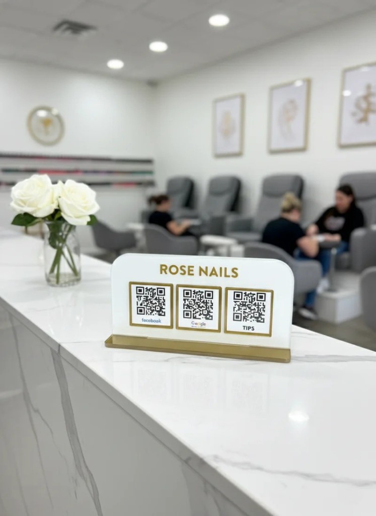 Rose Nails TapMeGo stand on marble reception counter